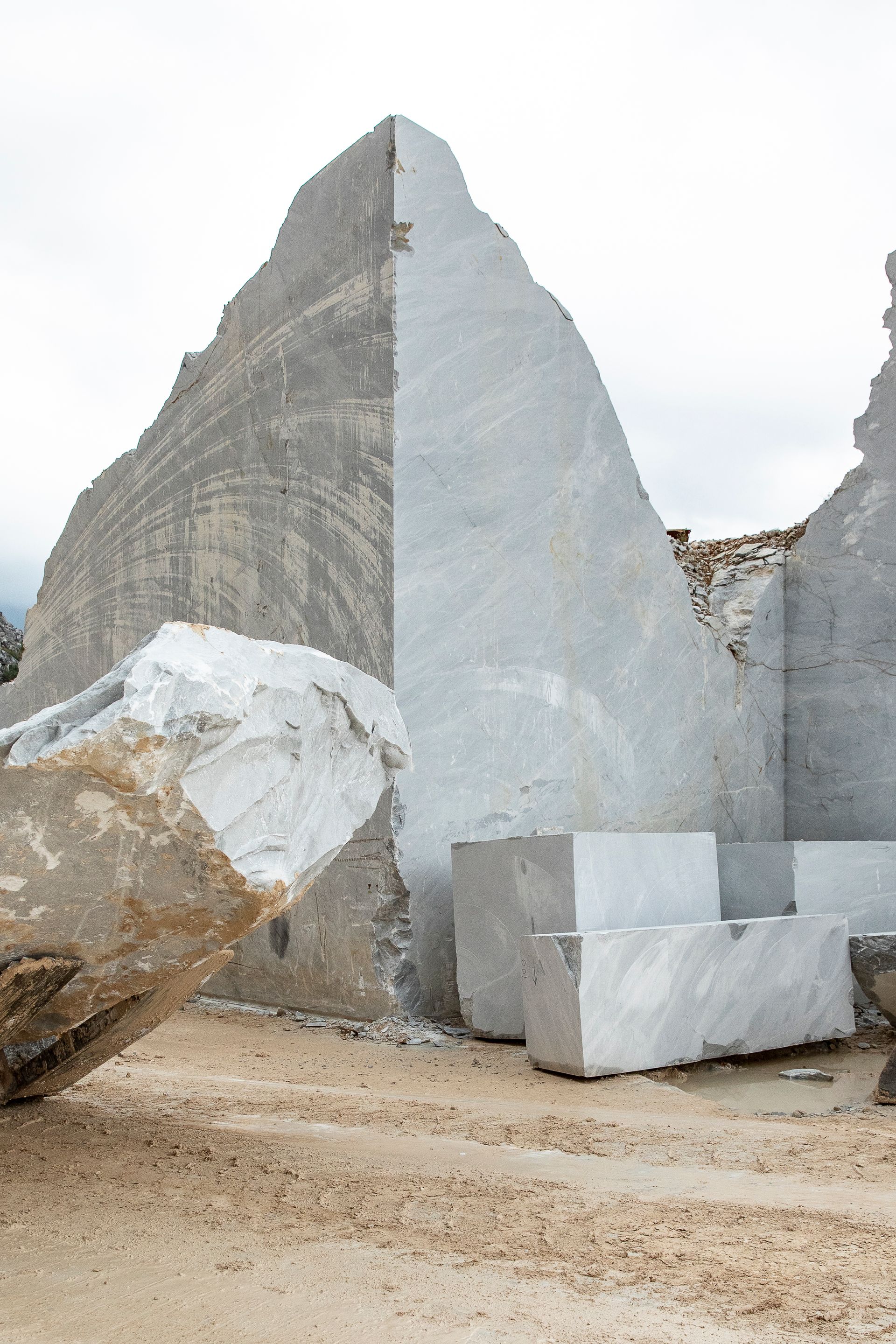 Visit to Carrara marble quarry, Tuscany, choice of materials and slabs. Officina Magisafi architecture design - marble blocks