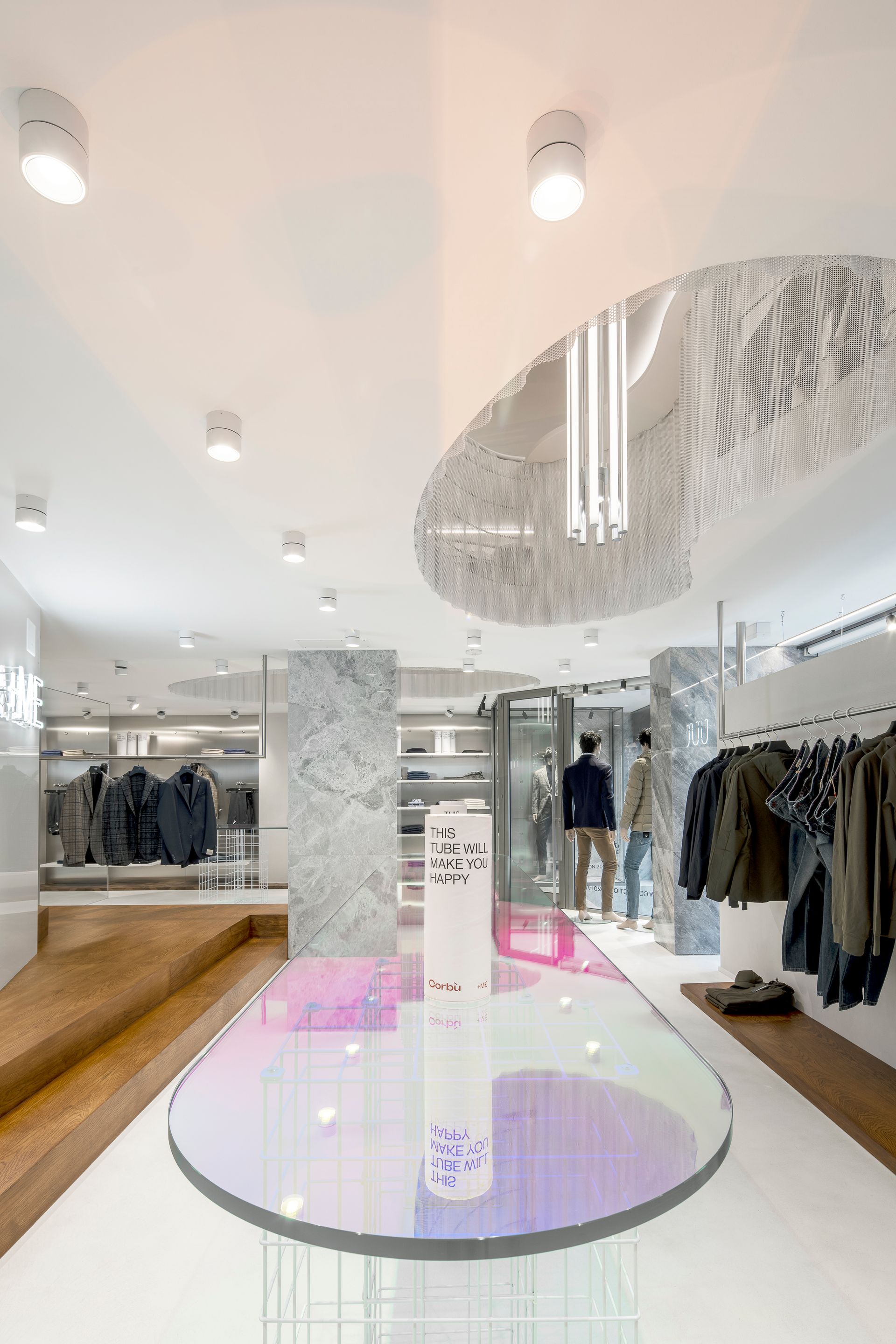 Interior design project, boutique remodeling and rebranding luxury fashion clothing Bergamo, Milan, Lake Como, London, New York, Paris. Officina Magisafi architecture design - central table detail