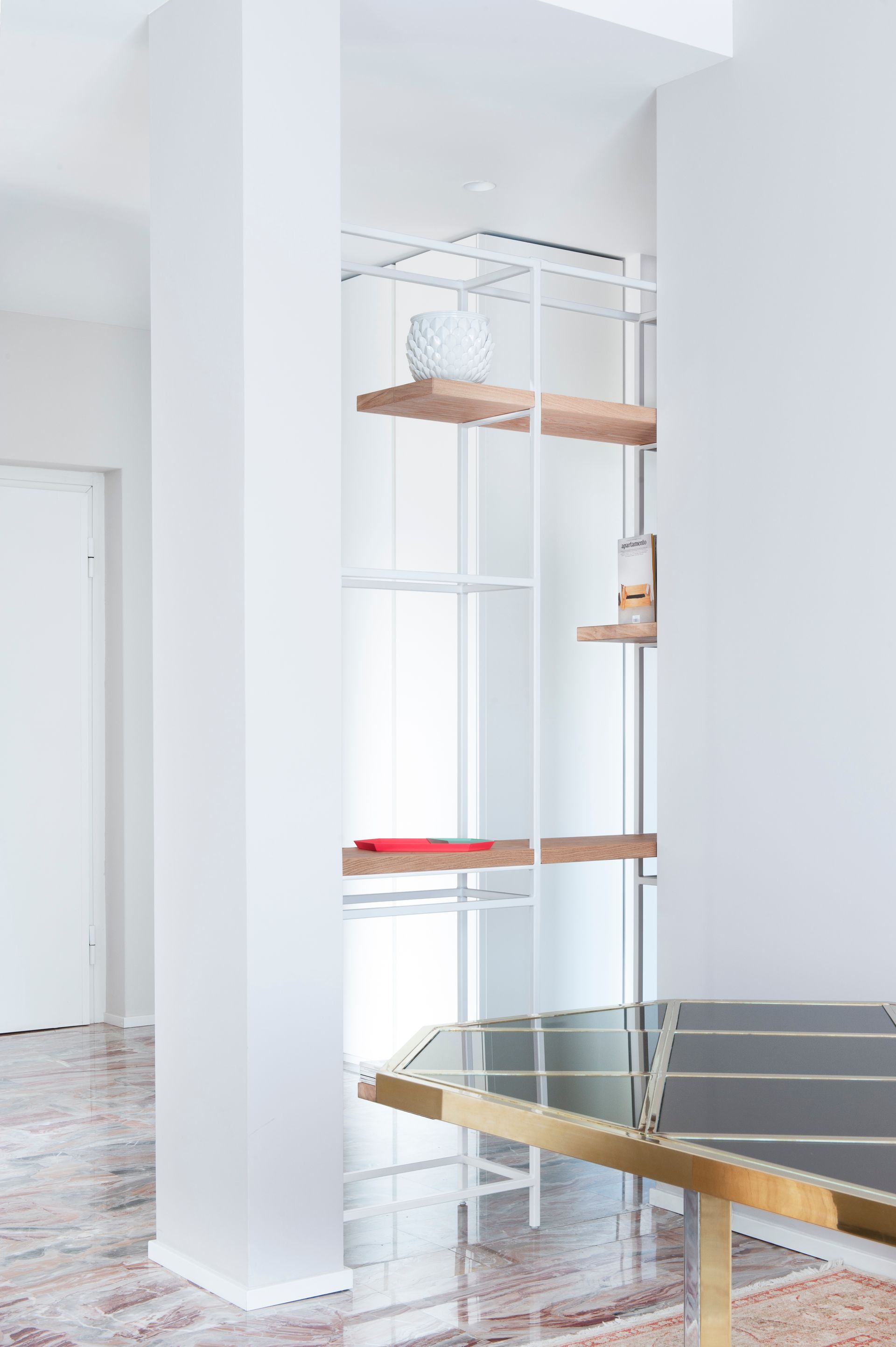 interior design project, luxury apartment renovation in the center of Bergamo, arabescato orobico marble, custom made bookcase, pieces of design - furniture detail