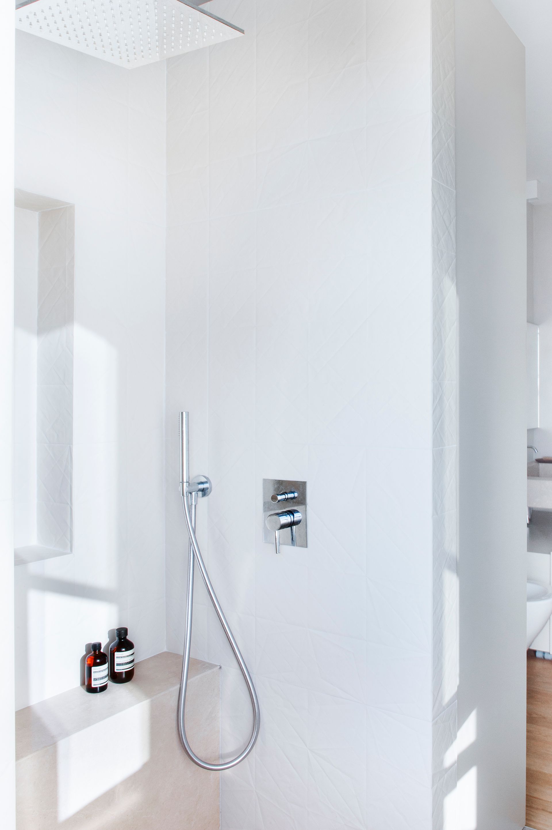 interior design project, luxury apartment bathroom renovation in the center of Bergamo, arabescato orobico marble, custom made bookcase, pieces of design - shower